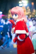 One of the cosplayers who had swapped her anime costume for a Christmassy one ...but not her mask.